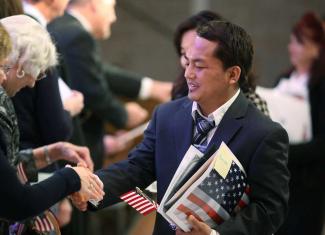 A man from Bangladesh takes part in a naturalisation ceremony in Oklahoma in 2018.