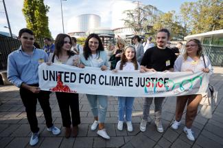 Six young claimants pose outside the European Court of Human Rights in Strasbourg where they challenge the climate inaction of various European countries.