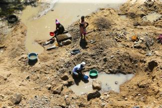 Small-scale miners at a riverbed on the outskirts of Harare.