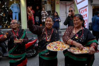 People in traditional attire celebrate the Yomari Punhi festival in Nepal’s capital Kathmandu in December. 