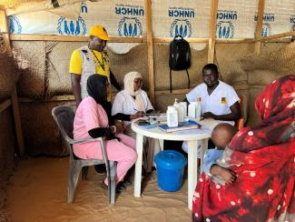 Humanitarian organisations work closely together in Chad, especially in light of global aid cuts.  A medical team with IRC and UNHCR staff at an initial reception centre in the border town of Adré.