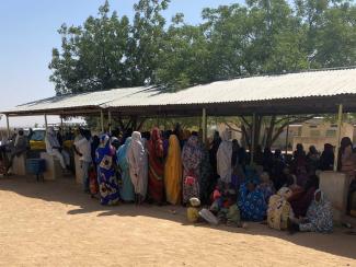 Patients wait in front of the IRC health centre in Farchana in eastern Chad.