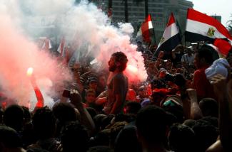 Ultra fans of Al Ahly protest against the government in Tahrir Square in Cairo in September 2011. 