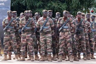 Soldiers wait for the funeral of Mali’s former defence minister, Sadio Camara, to begin. He died in an Islamist attack in Mali in April.