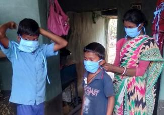 Putting on masks before going outside.