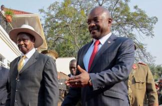 The wrong role models: Yoweri Museveni of Uganda (with hat) and Pierre Nkurunziza of Burundi in Bujumbura in July 2015.