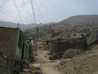 National circumstances matter: informal settlement in the Lima agglomeration