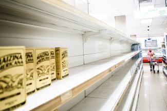 Empty supermarket shelves in Caracas in January.