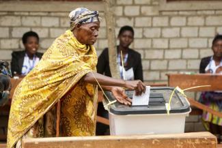 A Burundian citizen casts her vote.