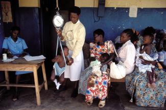 Mothers and children at a health centre in Uganda.