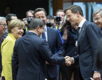 National leaders smiling in Brussels on 18 March: Angela Merkel (Germany), Ahmet Davutoglu (Turkey), David Cameron (Britain) and Mark Rutte (Netherlands).