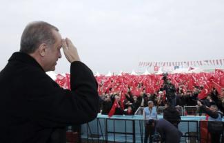 Erdogan salutes supporters in late 2016.