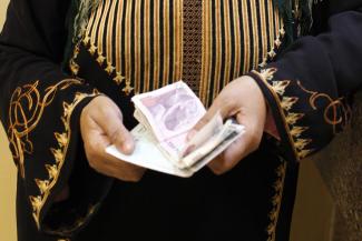 Philippe Lissac/GODONG/Lineair Money for development purposes does not always reach poor people: microcredit- agency client in Egypt.
