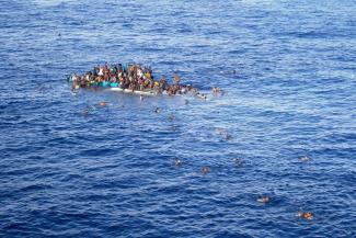 Refugees in a boat on the Mediterranean Sea.