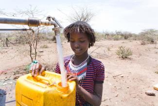 Ton Koene/Lineair Many places lack the money to finance water infrastructure: a girl collecting drinking water in Ethiopia.