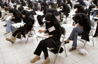 More than half of Iran’s students are female: young women taking an exam in Tehran in 2003.
