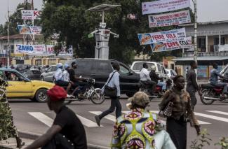 A solar-powered robot equipped with cameras and lights controls traffic in Kinshasa, DR Congo.