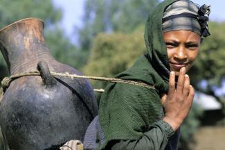 Ethiopia needs better infrastructure: rural women often walk kilometres to fetch water.