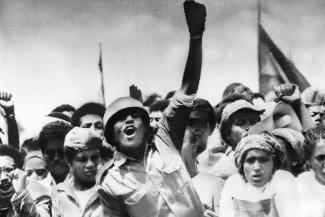 Soldiers and students cheer for  the Communists in 1977. There is proof that they where paid to do so.