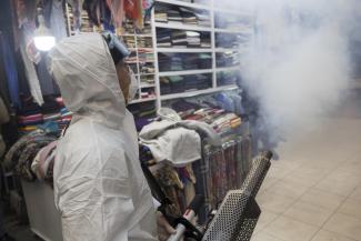 Desperate, but largely symbolical effort: disinfecting a bazaar in Tehran.