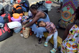 A woman from Cameroon tries to enter the US with her child at the Mexican border.