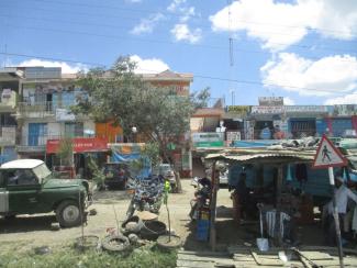 Growth in itself will not solve urban infrastructure problems: small shops on the outskirts of Nairobi.