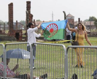 At a memorial service in Auschwitz (Oswiecim), Poland, a Roma flag is displayed in memory of the Roma and Sinti murdered by the German Nazi regime in the Second World War.