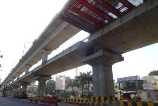 Sustainable transport boosts the economy: metro contstruction site in Nagpur, India, in 2019..