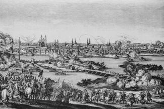 Die Idee des Völkerrechts entstand im 30-jährigen Krieg: Belagerung Magdeburgs 1631 – bei der anschließenden Zerstörung verloren Zehntausende das Leben.