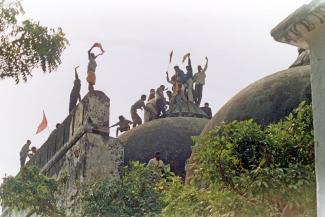 Hindu fanatics climbed Babri Mosque before tearing it down in Ayodhya in December 1992.