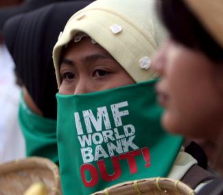 Bagus Indahono/picture-alliance/dpa Report In Indonesia, IFI reputation has suffered long-term: protestor in Jakarta in 2006.