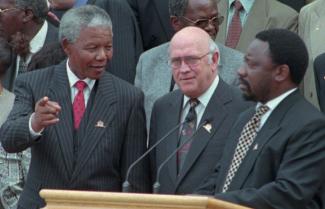 Celebrating the new constitution in May 1996: Nelson Mandela (then president), Frederik Willem de Klerk (deputy president) and Cyril Ramaphosa (chairman of the Constitutional Assembly).