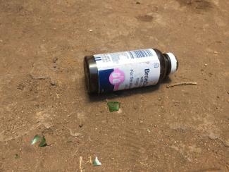 Moyo Empty BronCleer bottle on a street in Harare.