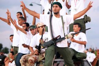 The EU’s response to the Arab spring might have been more satisfying, had external policies concerning security, development and the promotion of democracy been better coordinated and more focussed: Libyan insurgents celebrating the fall of Gaddafi in 2011.