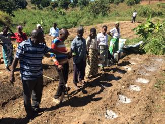 Participants listening to community-garden instructor.