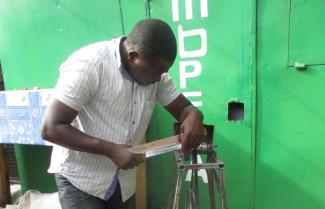 Informal businesses are common in Kenya: knife sharpening service in Nairobi.