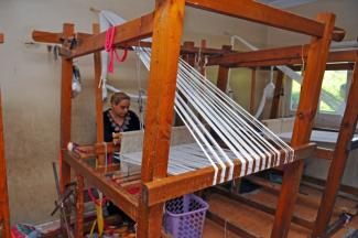 In Manshiet Nasr, Egypt, an NGO that employs women produces patchwork plaids and other textiles from old clothes.