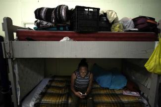 Migrant woman in a crowded shelter in Ciudad Juarez near the US border.