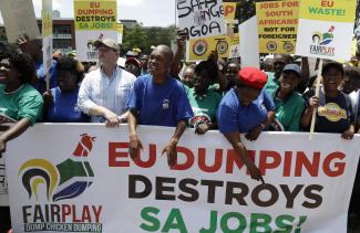 Workers from the South African poultry sector protest outside the EU headquarters in Pretoria in 2017. The protest followed plans by chicken producers to cut jobs, citing the impact of low-cost chicken imported from Europe.