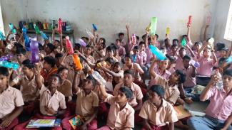 Learning about resin codes on plastic bottles in a Tamil Nadu government school.