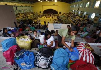Malasig/picture-alliance/dpa One year after Typhoon Haiyan, this gym on Leyte island was turned into a provisional shelter as another tropical strom was approaching.