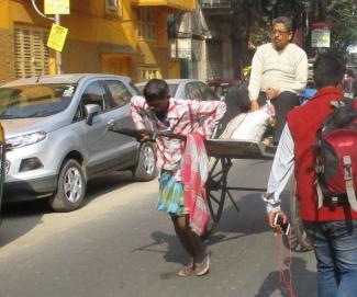 Disparities persist: rickshaw puller in Kolkata.