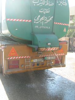 Wasting water  is wrong (“Fassad”)  in religious terms: leaky truck in Jordan.