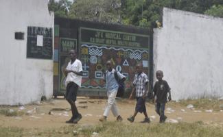 Children in front of a psychiatric hospital in Monrovia, Liberia. The Ebola crisis caused thousands of deaths in the West African country, and many people have struggled with mental-health problems ever since.