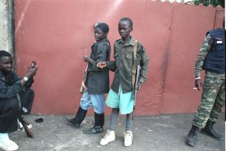 Many armed fighters do not wear standardised uniforms, but they all have weapons: child soldiers in Goma.