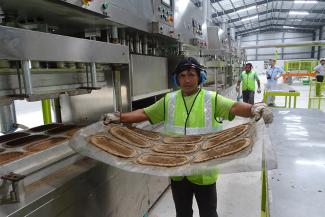 sb Production of biodegradable kidney dishes at the Bio-Lutions plant in Bangalore.