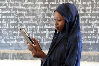 A girl from Niger receives online instruction: UNICEF helped supply 30 tablets to a school in Radi, in the country's south.