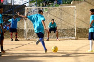 “Sports are very competitive”: football game in a Brazilian favela.