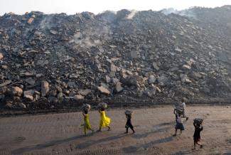 Coal has become increasingly important in India – people near strip mine in Jharkand.