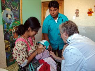 “The MDGs helped to focus attention on basic things such as health care”: rural patients in Guatemalan clinic.